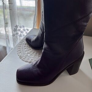 Like new pair of Franco Sarton Stevie boots. Beautiful Plum color. Size 9.